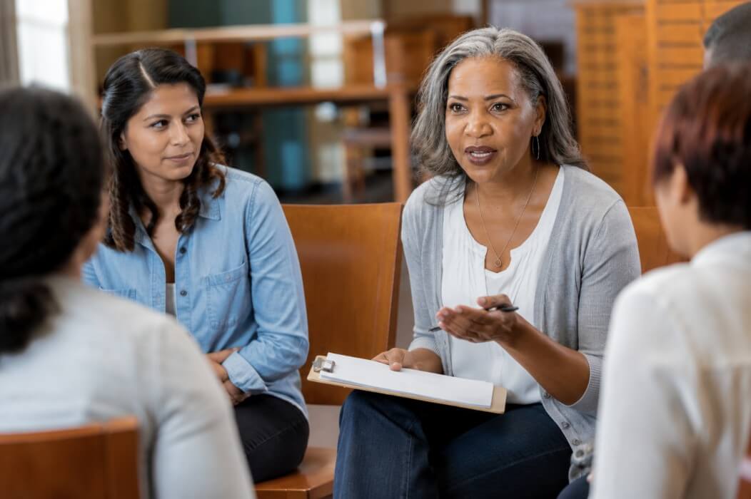 A certified peer supporter leading a support group